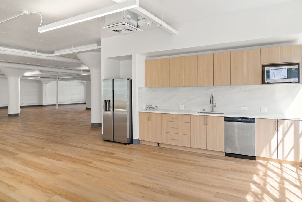 Finished office kitchenette with modern cabinetry